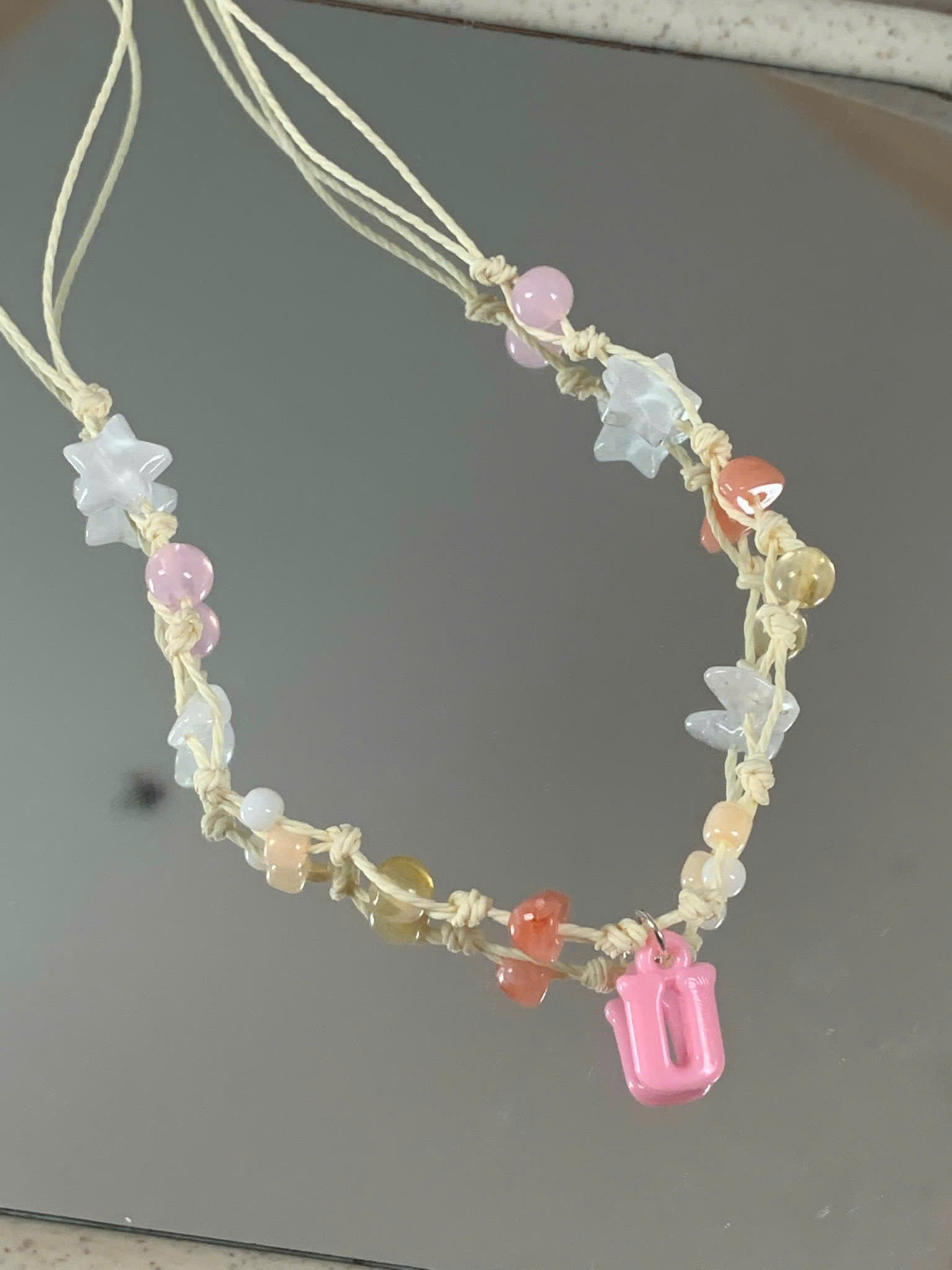 Dây chuyền charm chữ thắt nút